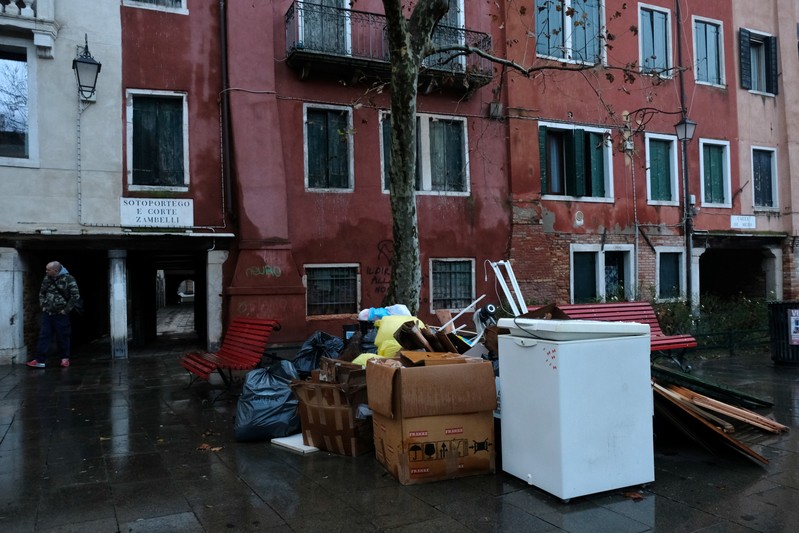 Waste from flooded households piled in the street caused by days of severe flooding in Venice