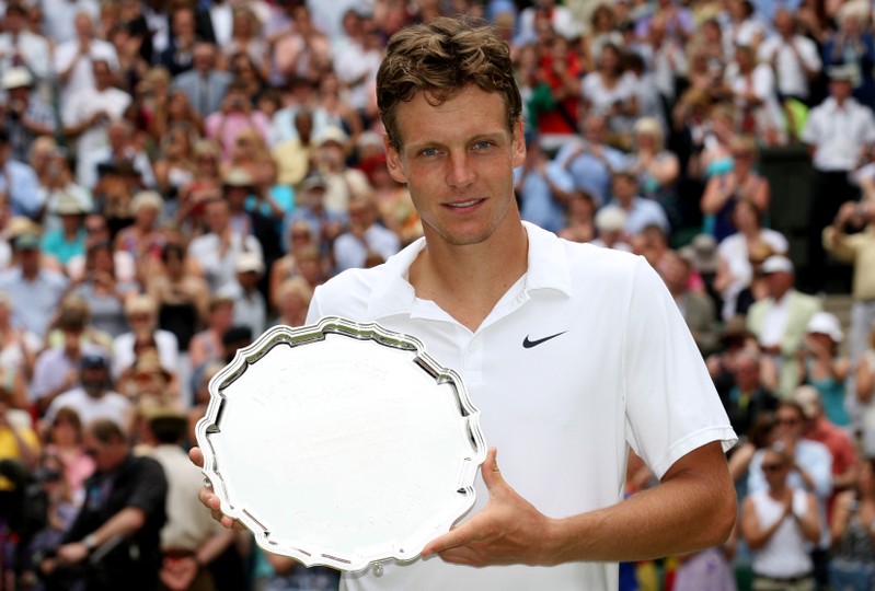 FILE PHOTO: Czech Republic's Tomas Berdych poses with a trophy after losing the Men's Singles Final
