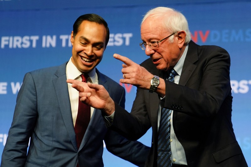 Julian Castro and Bernie Sanders are pictured on stage at a First in the West Event at the Bellagio Hotel in Las Vegas