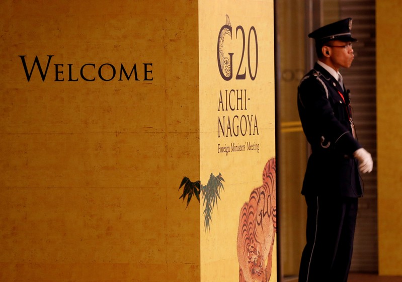 A guard stands in front of an entrance of the venue of G20 Foreign Ministers meeting in Nagoya