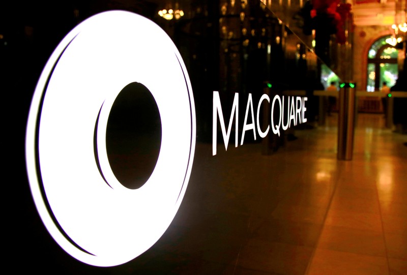 FILE PHOTO: The logo of Australia's Macquarie Group Ltd adorns a desk in the reception area of their Sydney office headquarters