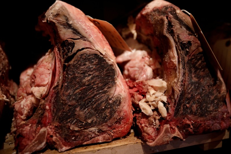 FILE PHOTO: Cuts of USDA prime dry-aged beef are seen in the dry-aging room in the lobby of Gallaghers steakhouse in the Manhattan borough of New York City