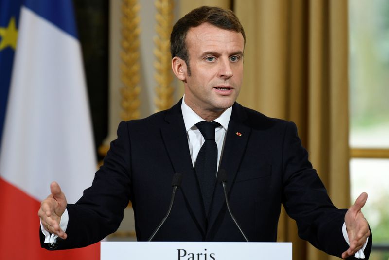 French President Emmanuel Macron takes part in a news conference with NATO Secretary General Jens Stoltenberg after their meeting at the Elysee palace in Paris