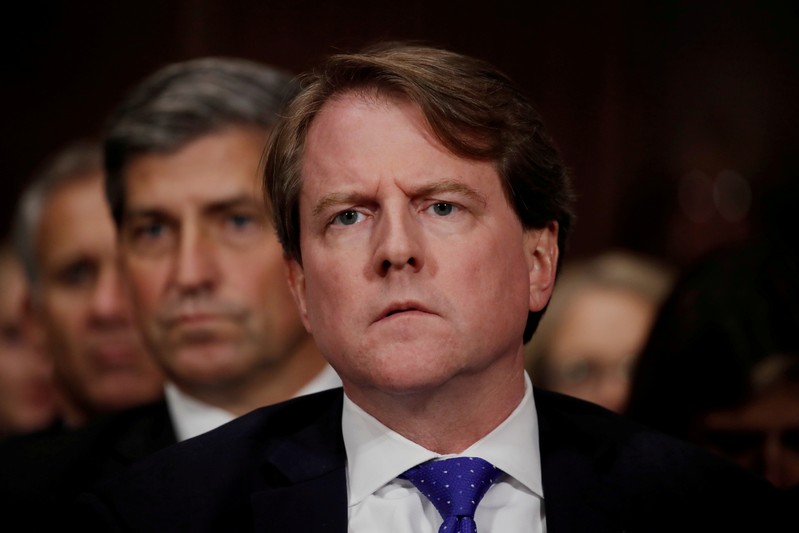 FILE PHOTO: White House coounsel Don Mcgahn listens to U.S. Supreme Court nominee Kavanaugh testify at his Senate Judiciary Committee confirmation hearing on Capitol Hill in Washington