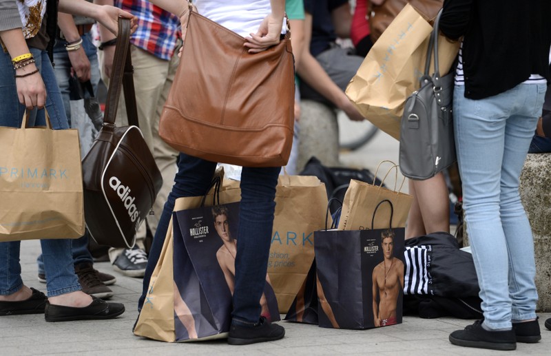 File photo of shoppers resting with their purchases in downtown Hanover
