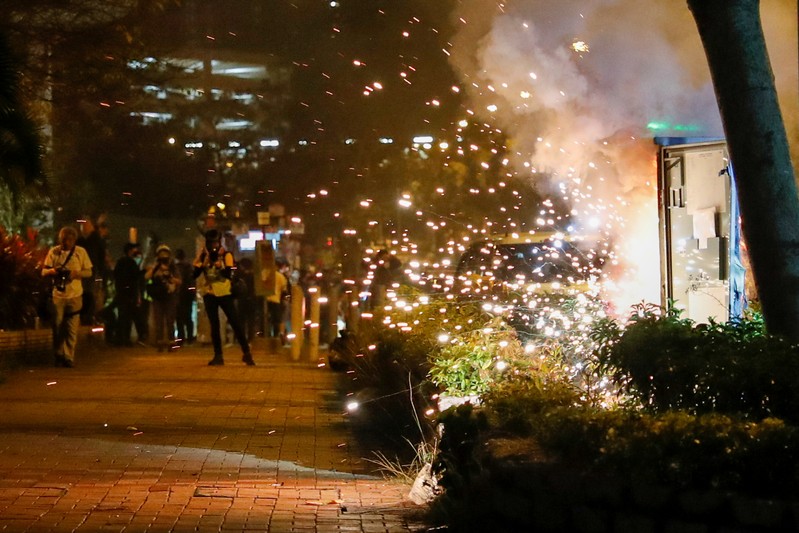 An electricity switch box explodes as it was set on fire by protesters, after Chow Tsz-lok, 22, a university student, died after he fell during a protest, at Tseung Kwan O, Hong Kong