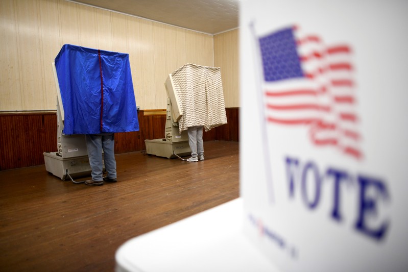 Voters arrive to cast their ballots in state and local elections at Pillow Boro Hall in Pillow