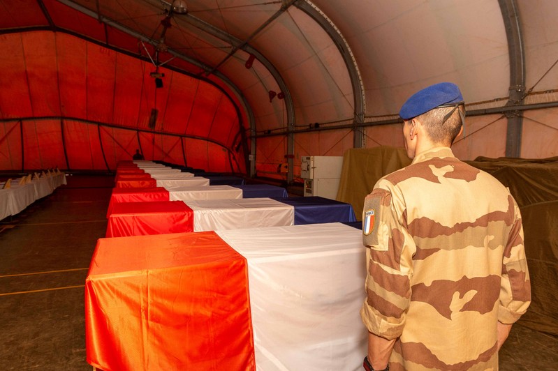 A soldier pays tribute to his late commanders at Gao French Army base