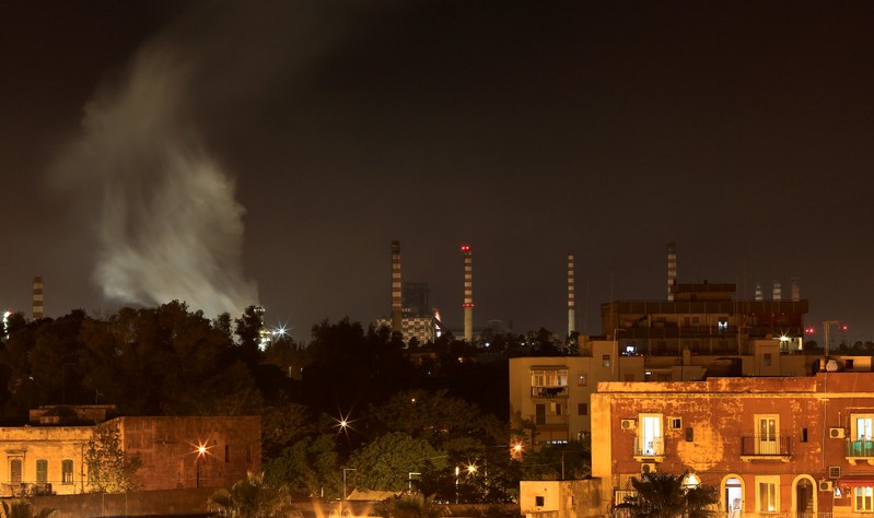 FILE PHOTO: The ILVA steel plant is seen next to the Tamburi district, in Taranto, Italy