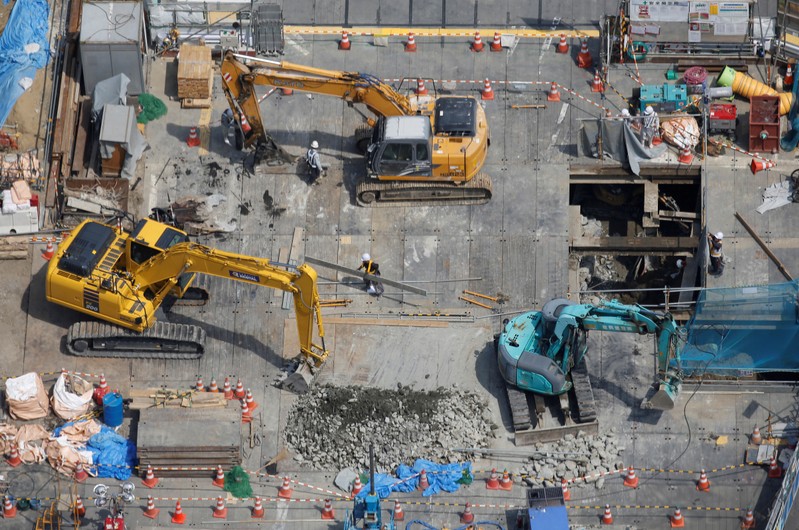 FILE PHOTO: Heavy machinery is seen at a construction site in Tokyo