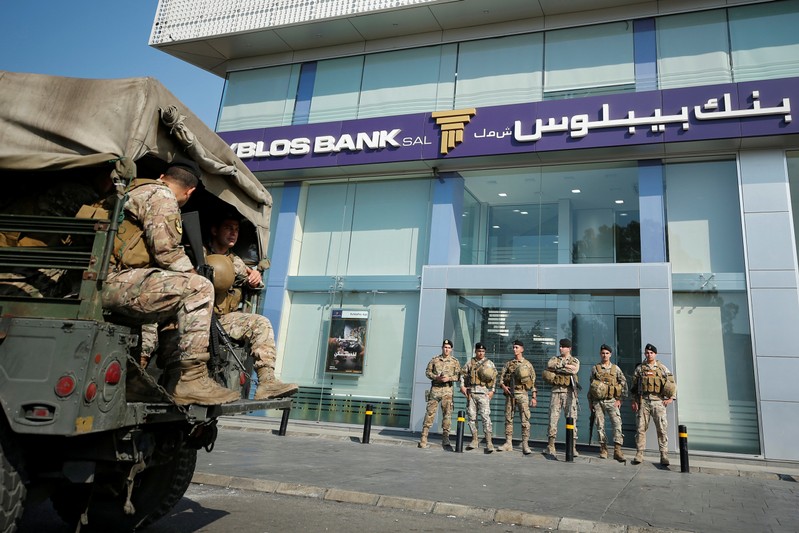 FILE PHOTO: Lebanese army soldiers stand guard outside a branch of Byblos Bank in the southern city of Sidon