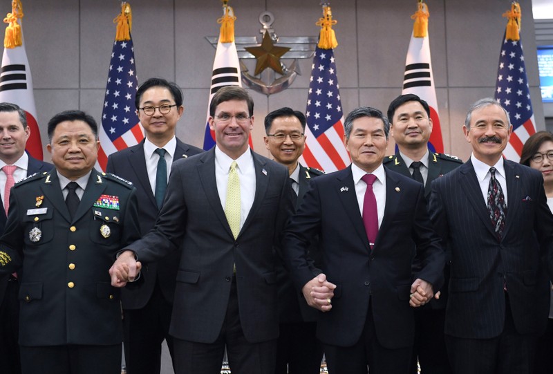FILE PHOTO: U.S. Defense Secretary Esper holds hands with South Korean Defense Minister Jeong before their meeting in Seoul