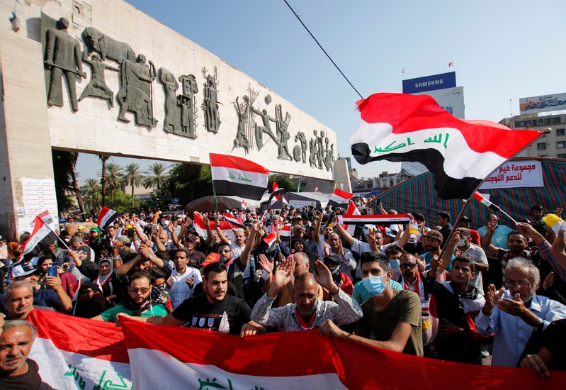 Iraqi demonstrators take part at ongoing anti-government protests at Tahrir Square in Baghdad