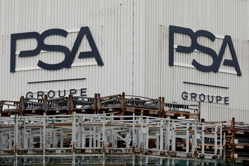 The logo of PSA Peugeot Citroen is seen at the company's plant in Poissy, near Paris