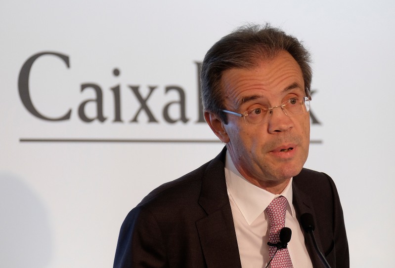 FILE PHOTO: Caixabank's Chairman Jordi Gual speaks to the media during the presentation of the bank's 2017 full year results in Valencia, Spain