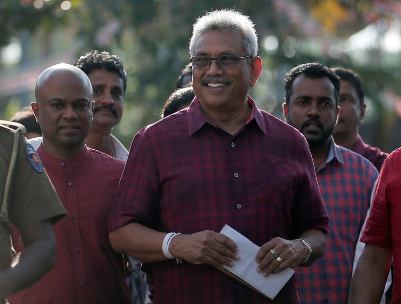 Sri Lanka People's Front party presidential election candidate and former wartime defence chief Rajapaksa leaves after casting his vote during the presidential election in Colombo