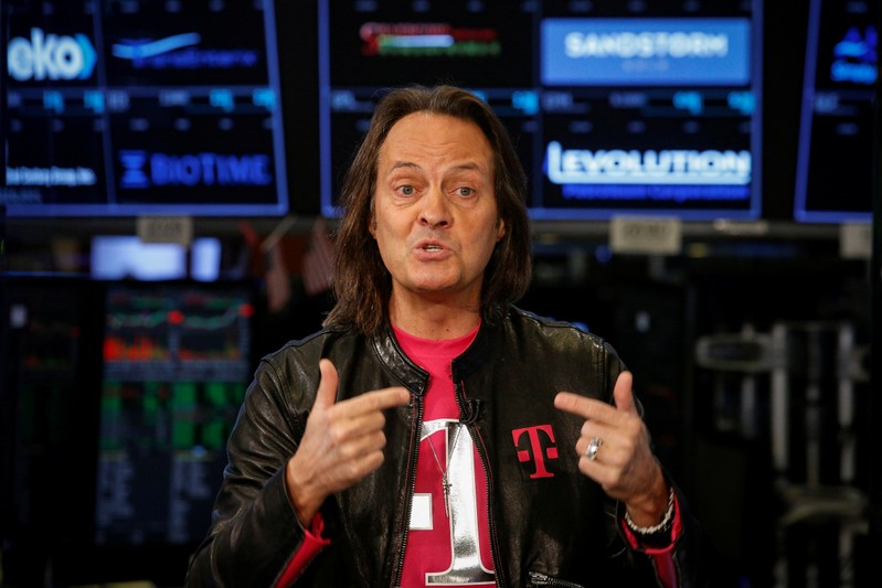 T-Mobile CEO John Legere speaks about his company's merger with Sprint during an interview on CNBC on the floor of the NYSE in New York City