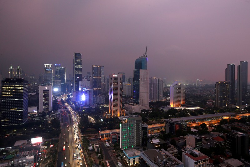 FILE PHOTO: General view of a business district at sunset in Jakarta