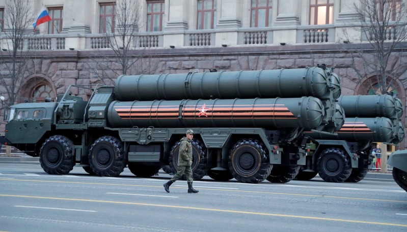 FILE PHOTO: A Russian serviceman walks past air defence systems before a rehearsal for the Victory Day parade in central Moscow