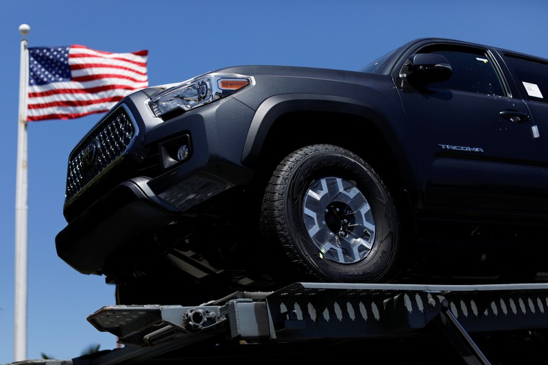 FILE PHOTO: Toyota trucks are shown on a car carrier for delivery after arriving in the United States in National City, California