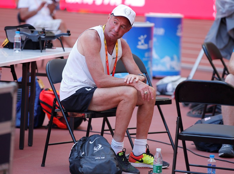 FILE PHOTO: Alberto Salazar, coach to Mo Farah of Britain and Galen Rupp of the U.S.A. sits inside the Bird's Nest Stadium at the Wold Athletics Championships in Beijing