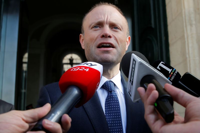 Malta's Prime Minister Joseph Muscat talks to the media as he arrives at his office at Auberge de Castille in Valletta