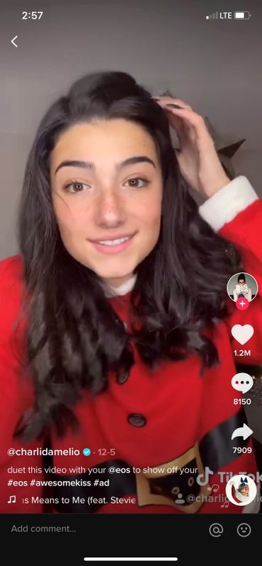A screengrab shows a video of TikTok creator Charli D’Amelio taking part in a holiday marketing campaign on TikTok for beauty brand eos Products