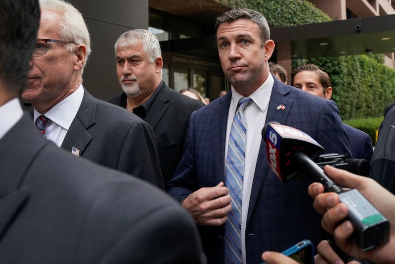 U.S. Representative Duncan Hunter leaves federal court after pleading guilty to misusing campaign funds in San Diego