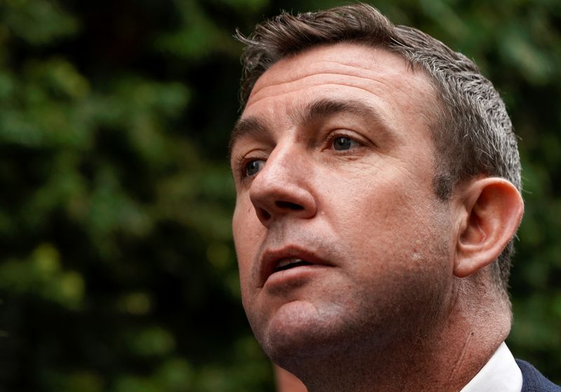FILE PHOTO: U.S. Representative Duncan Hunter leaves federal court after pleading guilty to misusing campaign funds in San Diego