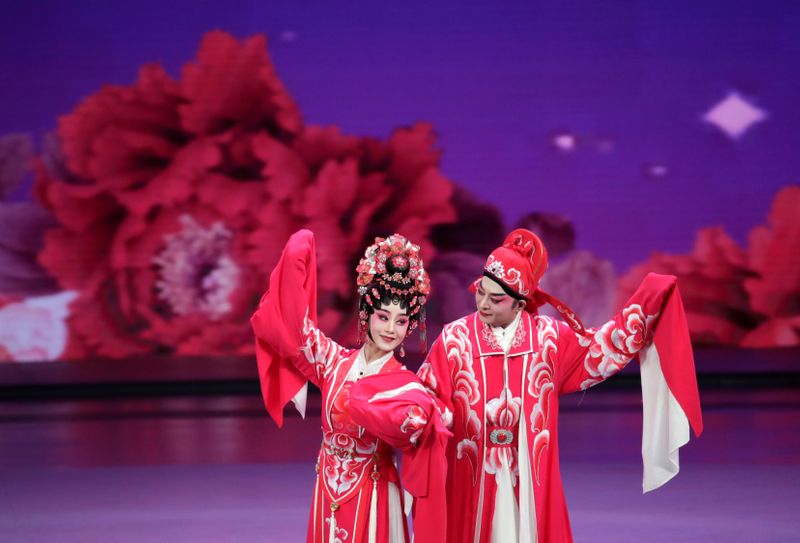 Performers take part in a cultural performance in Macau