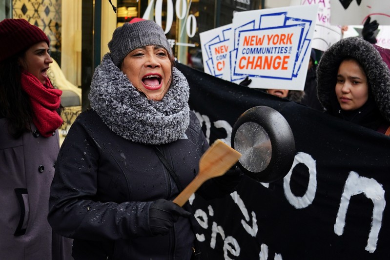 A woman takes part in a rally against Amazon and their business practices in the Manhattan borough of New York City