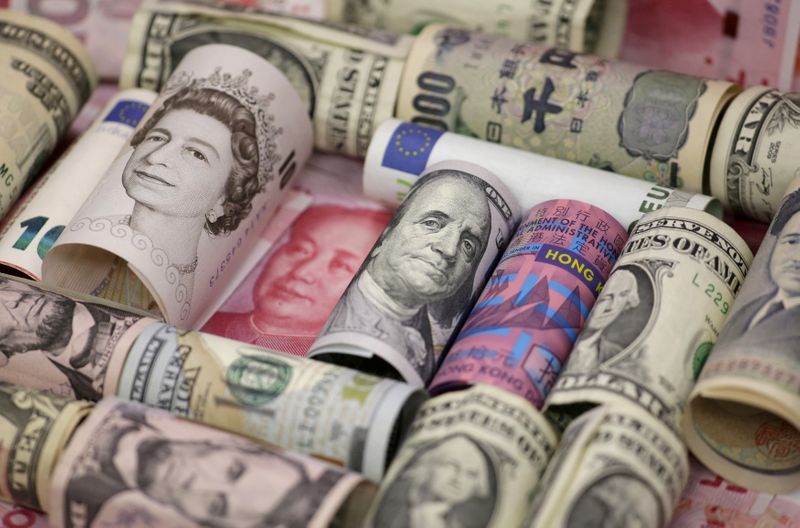 FILE PHOTO: Euro, Hong Kong dollar, U.S. dollar, Japanese yen, British pound and Chinese 100-yuan banknotes are seen in a picture illustration