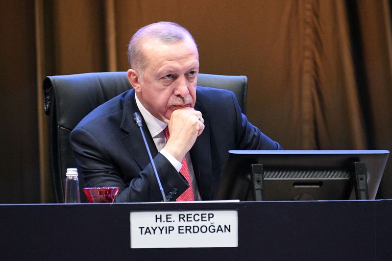 FILE PHOTO: Turkey's President Recep Tayyip Erdogan reacts during a Kuala Lumpur Summit roundtable session in Kuala Lumpur