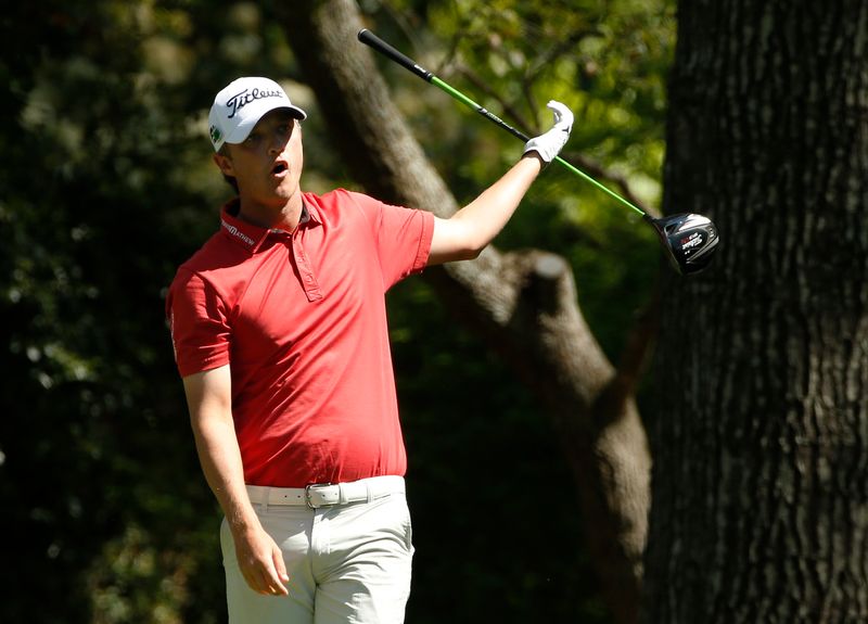Australia's Matt Jones drops his club after his tee shot on the second hole during the first round of the 2014 Masters golf tournament at the Augusta National Golf Club in Augusta