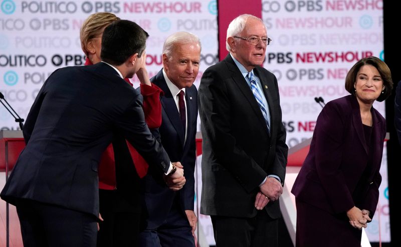 Candidates before the start of the sixth 2020 U.S. Democratic presidential candidates campaign debate at Loyola Marymount University in Los Angeles, California, U.S.