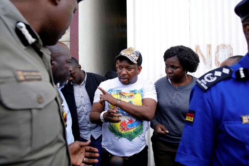 Nairobi's Governor Mike Sonko is escorted by police officers after his arrest, at the Wilson airport in Nairobi