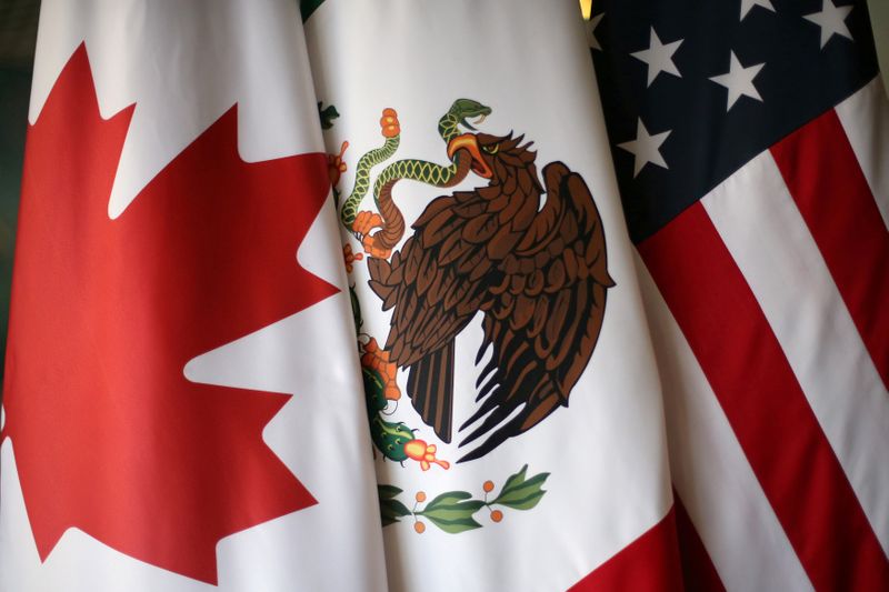FILE PHOTO: Flags are pictured during the fifth round of NAFTA talks involving the United States, Mexico and Canada, in Mexico City