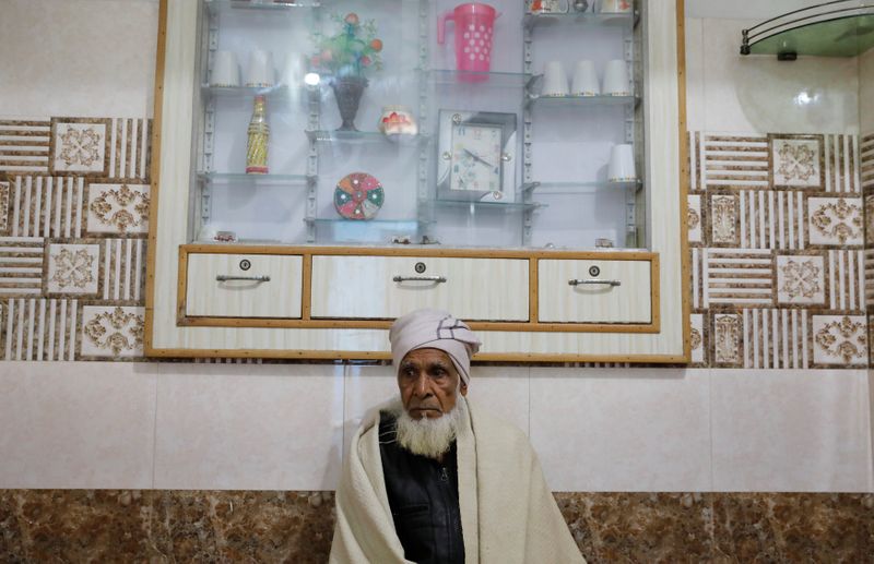 Munshi Ahmed, father of Zaheer Ahmed, who died during clashes with police following protests against a new citizenship law, sits inside house in Meerut