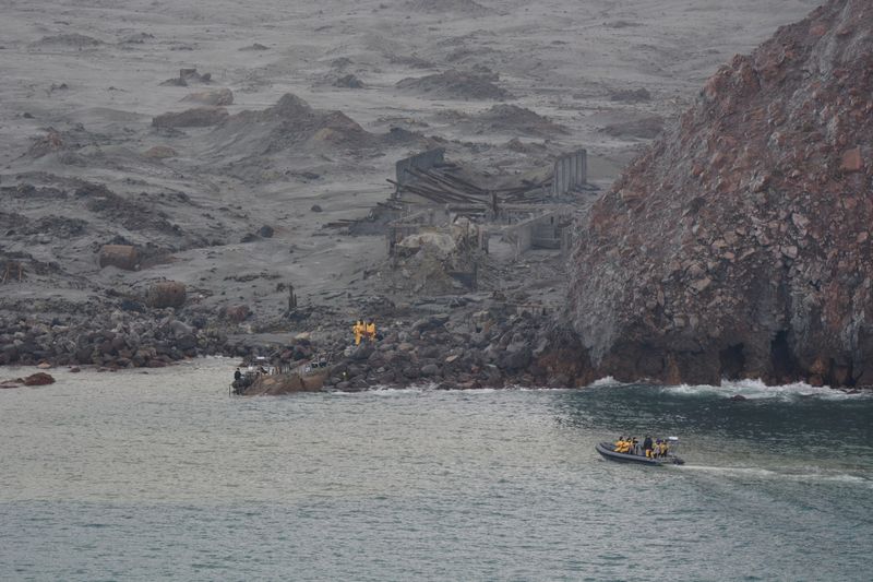 FILE PHOTO: Rescue crew are seen at the White Island volcano in New Zealand