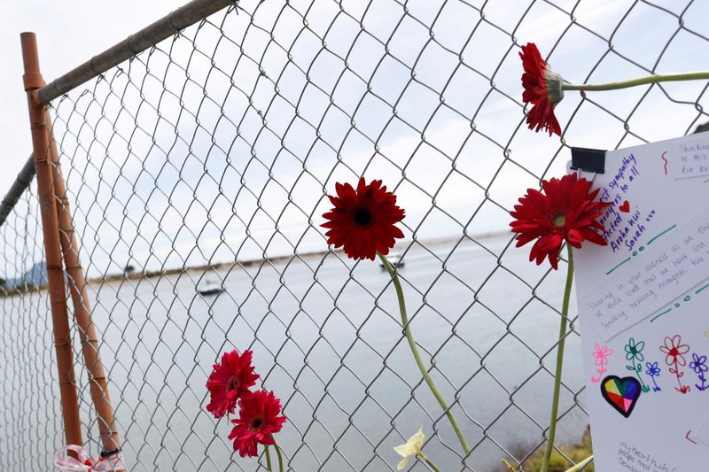 FILE PHOTO: Flowers are seen at a memorial at the harbour in Whakatane, following the White Island volcano eruption in New Zealand