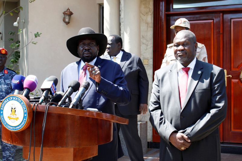 South Sudan's President Kiir speaks during news statement with former VP and rebel leader Machar after their meeting Juba