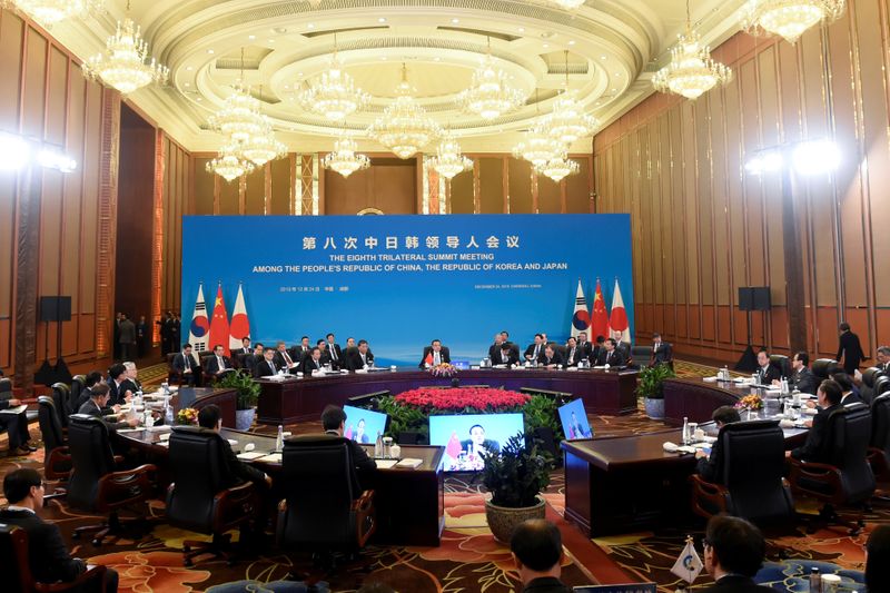 China's Premier Li Keqiang, Japan's Prime Minister Shinzo Abe and South Korea's President Moon Jae-in attend the 8th trilateral leaders' meeting between China, South Korea and Japan in Chengdu