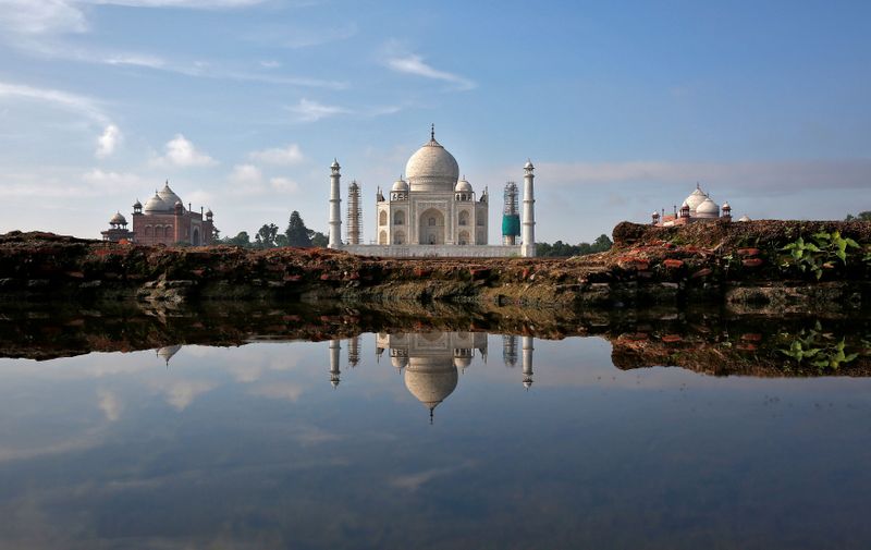 FILE PHOTO: The Taj Mahal is reflected in a puddle in Agra