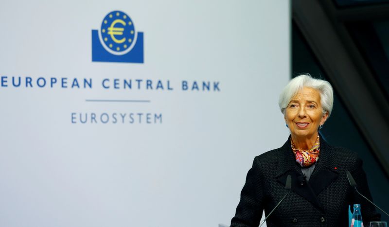 FILE PHOTO: European Central Bank (ECB) President Lagarde gives a signature for newly printed euro banknotes in Frankfurt