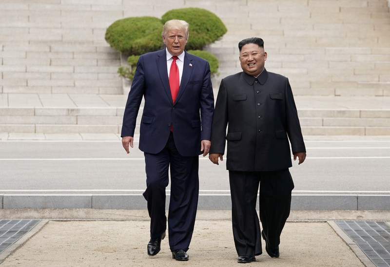 FILE PHOTO: U.S. President Donald Trump and North Korean leader Kim Jong Un meet at the Korean Demilitarized Zone