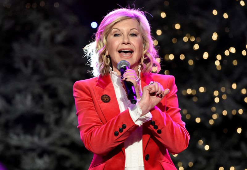 FILE PHOTO: Olivia Newton-John performs before the 85th annual Hollywood Christmas Parade in Los Angeles
