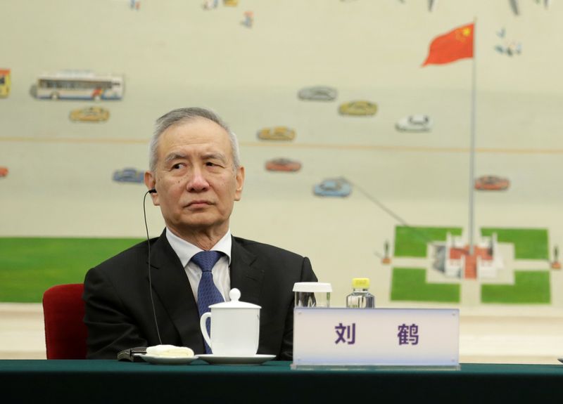 FILE PHOTO: Chinese Vice Premier Liu He attends a meeting with delegates from the 2019 New Economy Forum in Beijing