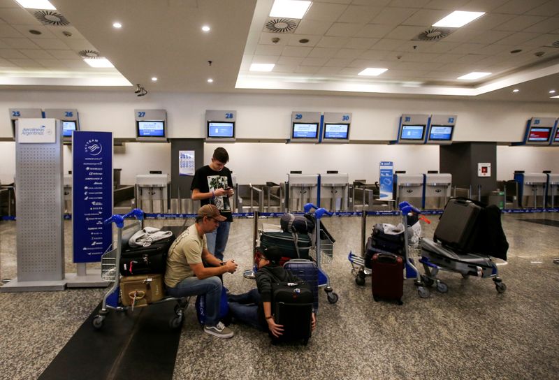 Passengers wait at Buenos Aires' airport as flights were cancelled during a 24-hour strike called by Argentina's state-owned airline Aerolineas Argentinas pilots and other personnel at Buenos Aires