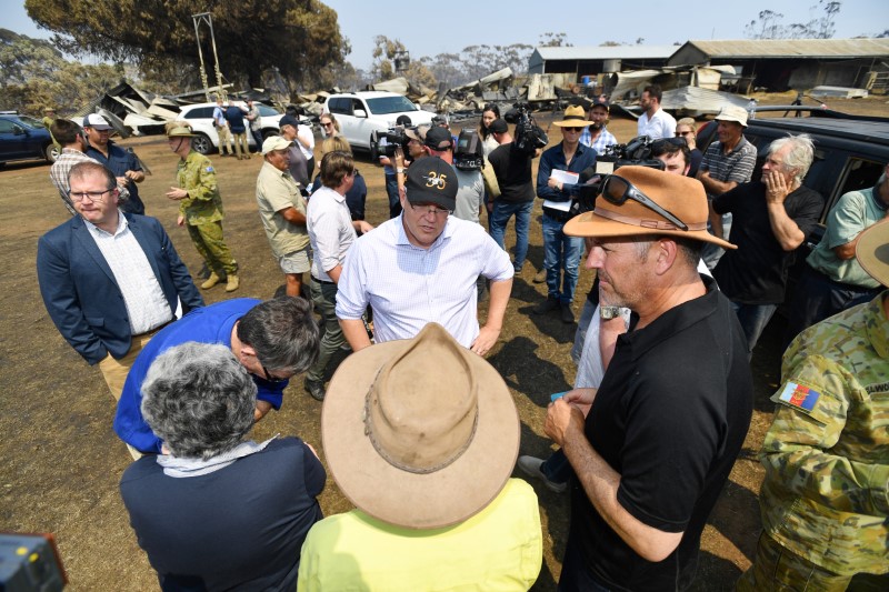 FILE PHOTO: Australian Prime Minister Scott Morrison is seen visiting a fire-damaged property on Stokes Bay on Kangaroo Island
