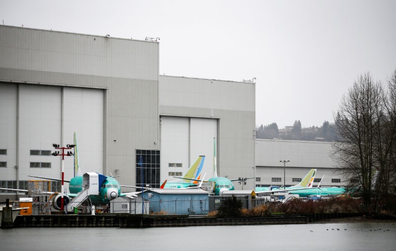 FILE PHOTO: Boeing 737 Max aircraft are seen parked outside the company's production facility in Renton